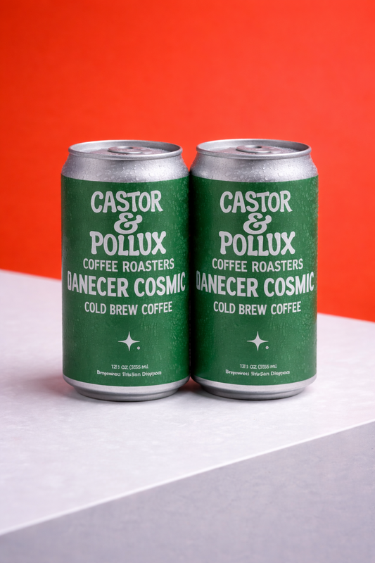Two green cans of Castor & Pollux coffee against a red and gray background