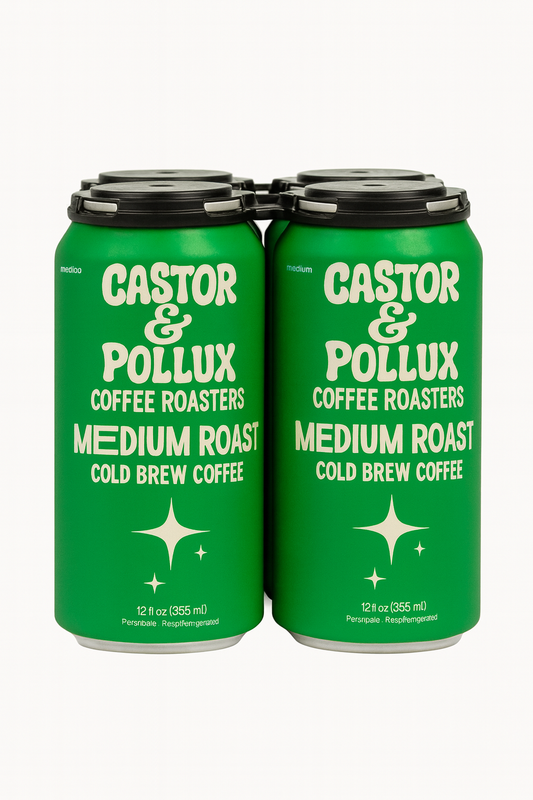 A four-pack of Castor & Pollux Coffee Roasters’ Medium Roast cold brew cans, shown in vibrant green with cream lettering and a black carrier on a white background.