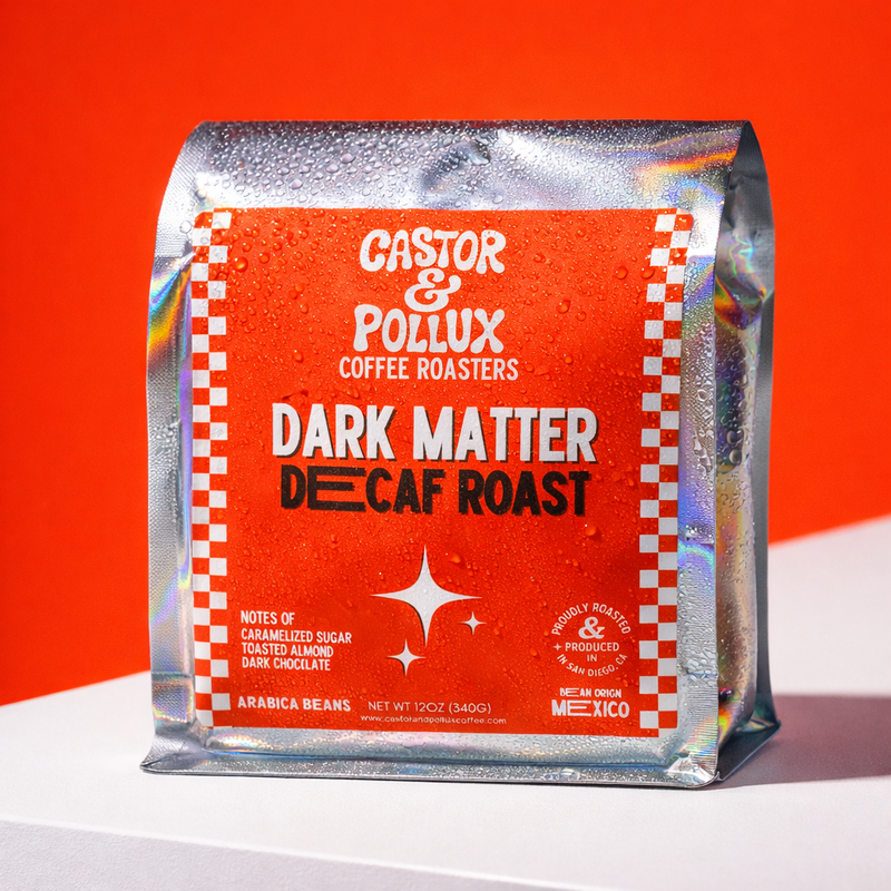 Coffee package labeled 'Castor & Pollux Coffee Roasters Dark Matter Decaf Roast' on a red background